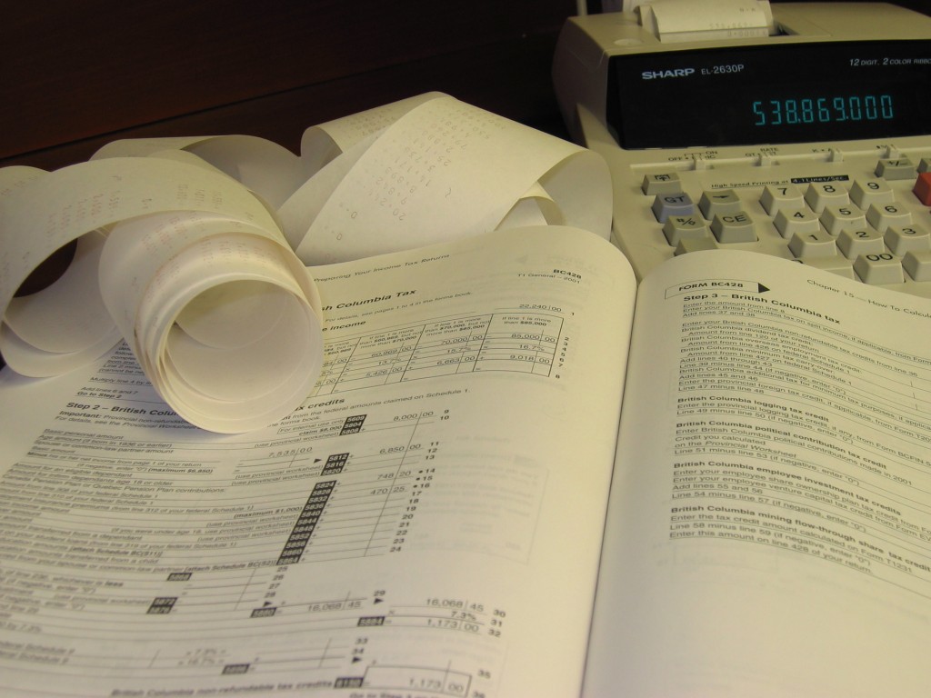 Accouinting Standards Rolled Paper, Books, and Calculator